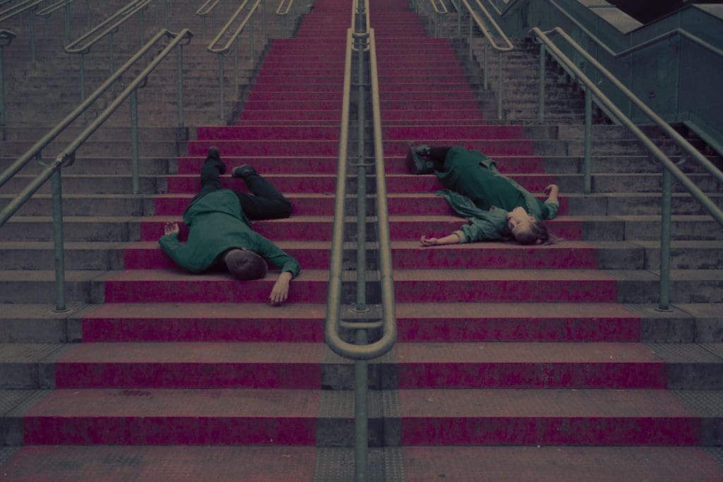 couple portrait on staircase surreal interpretation