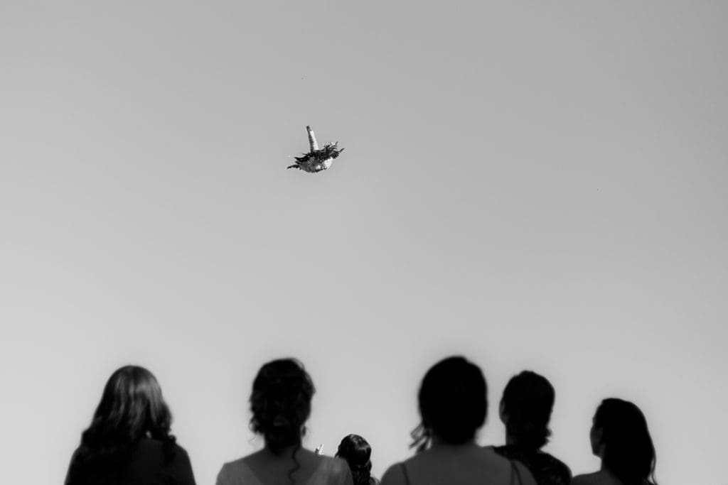 bouquet toss in the air black and white wedding photography