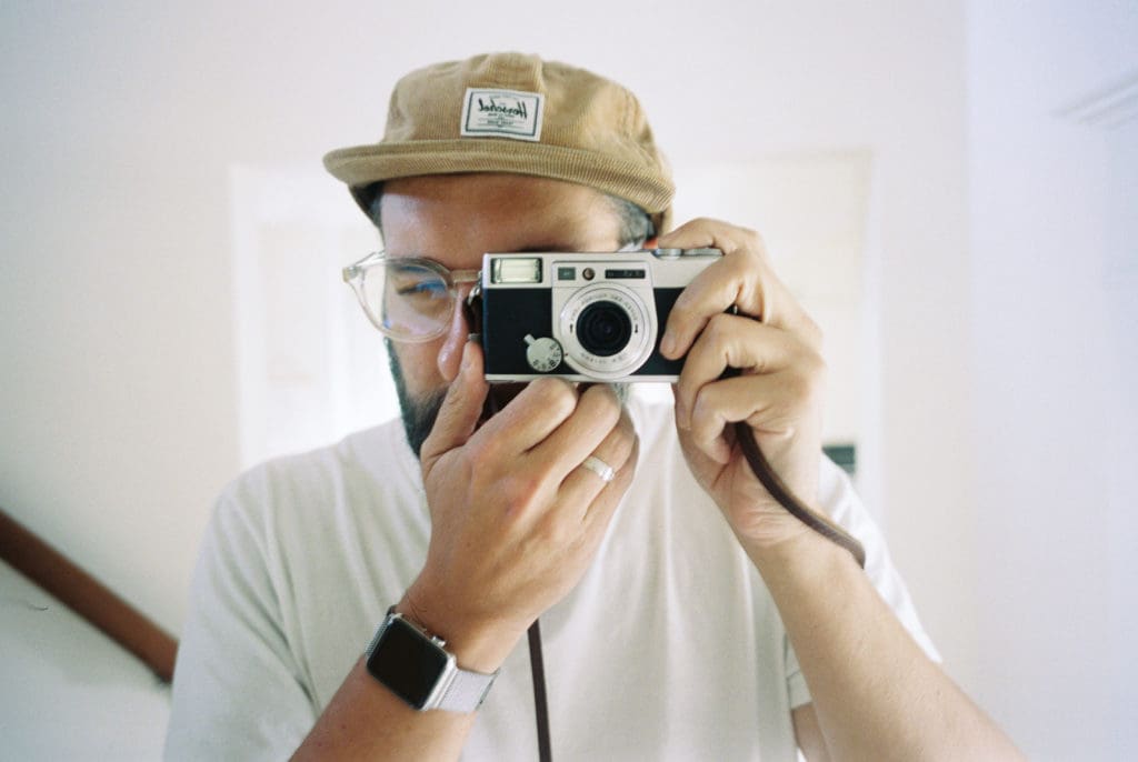 Benj Haisch uses a point-and-shoot to document with film.