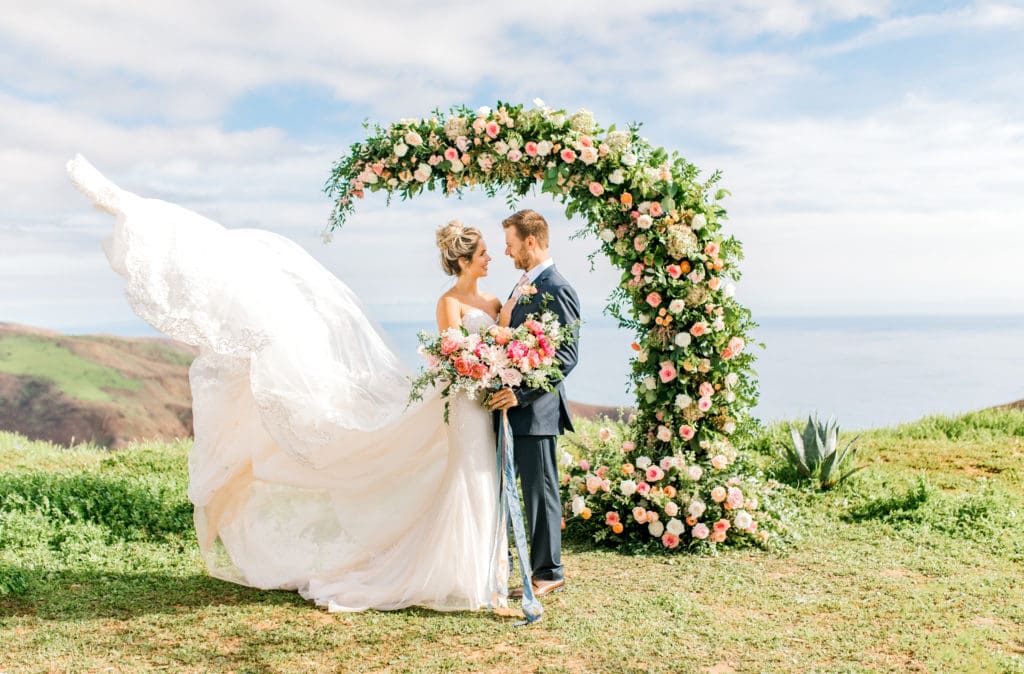 wedding photographer captures white wedding dress in air for drama