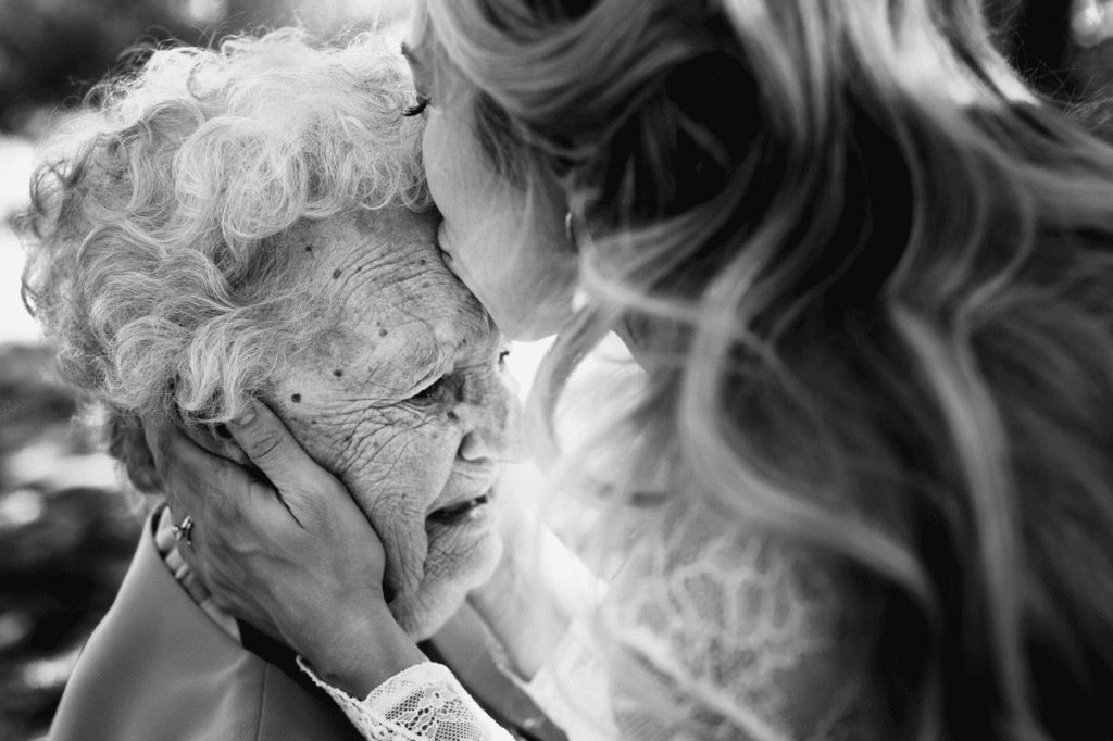 A special kiss between a bride and her grandmother.