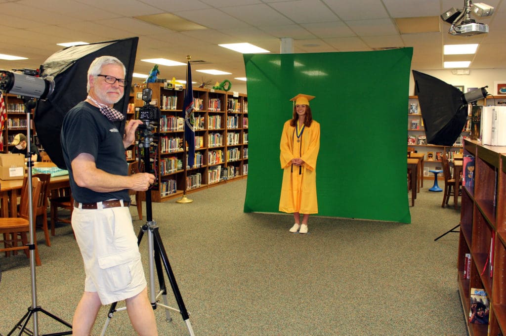 School photographer takes socially distanced class photo