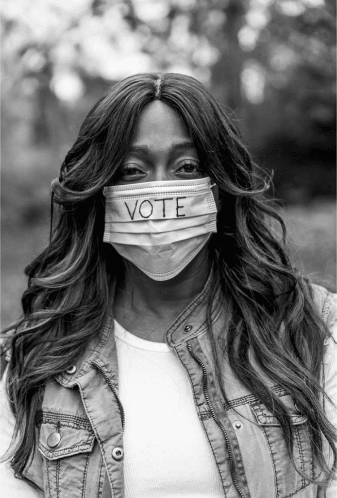 An image by Brooke Bartletta of a woman wearing a vote mask