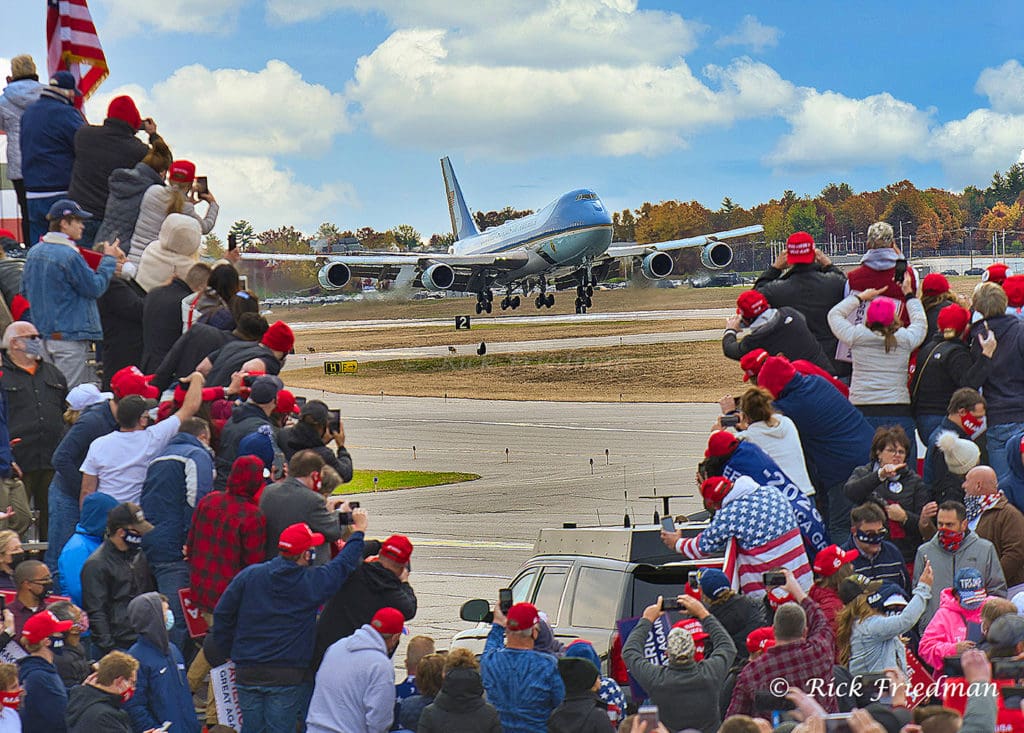 Trump supporters wait at rally as plane arrives with 2020 presidential candidate