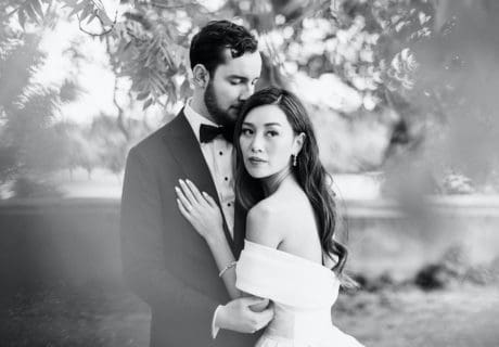 timeless black and white portrait of bride and groom outside.