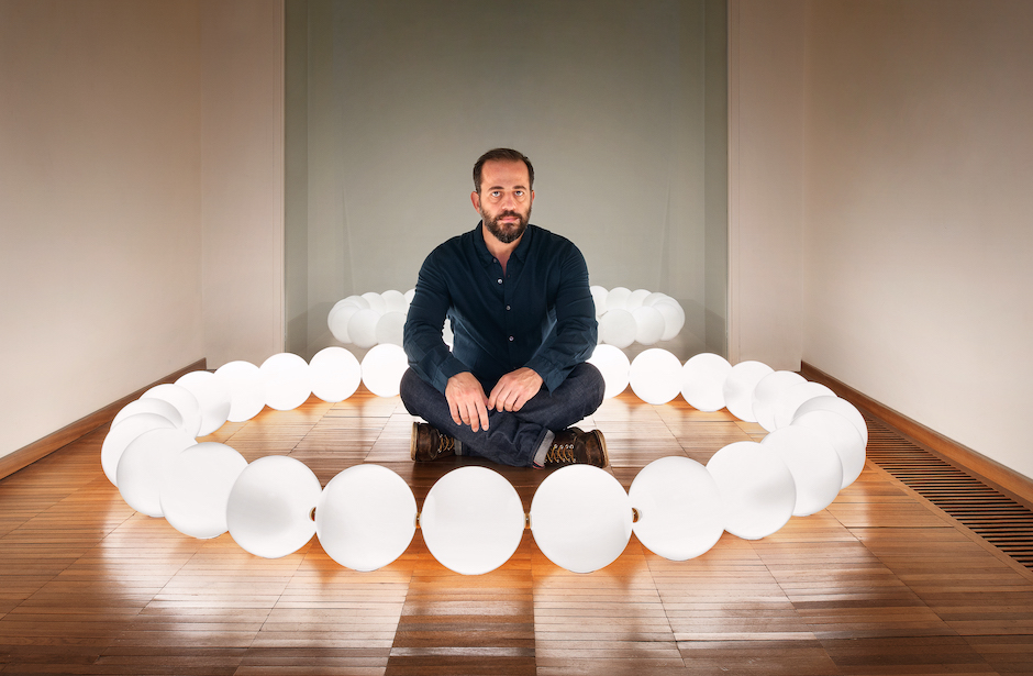 Lighting designer Michael Anastassiades with his light sculpture "Ama".