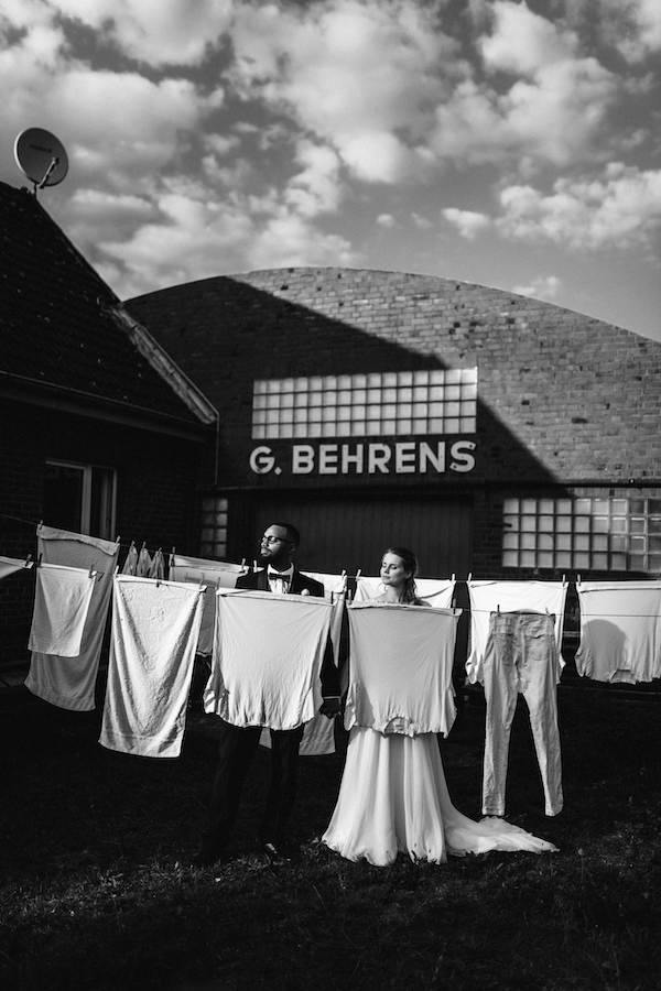 From our photos of the week selects—a wedding couple in between a clothesline.