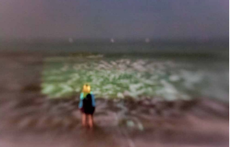 Viewed at the Palm Springs Photo Festival, an image by Eric Lawton of a little girl gazing out at the ocean.