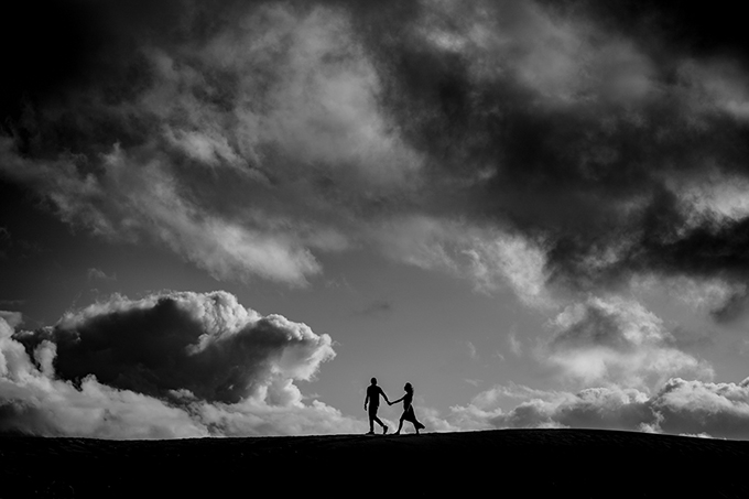 A couple on a sand dune in Australia.