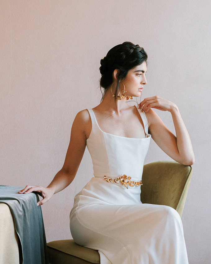 portrait of a woman sitting in chair.