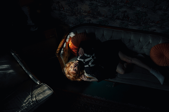 eye-catching editorial shoot in a dimly lit bar.