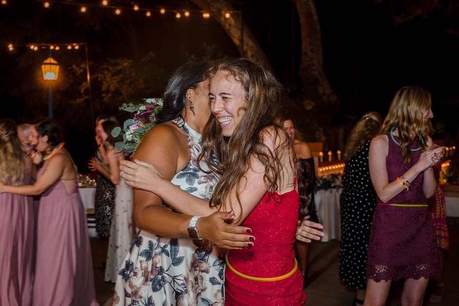 A hug between wedding guests.
