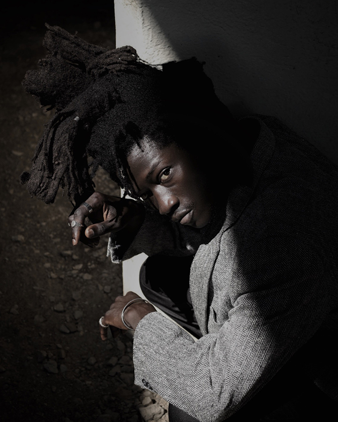 justin jackson portrait of model from ghana outdoors in shadow