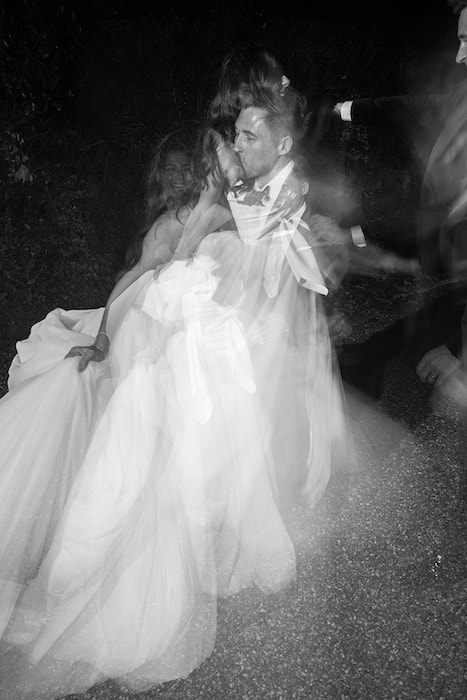 portrait of bride and groom with shutter drag of bride's dress and entire dance move..