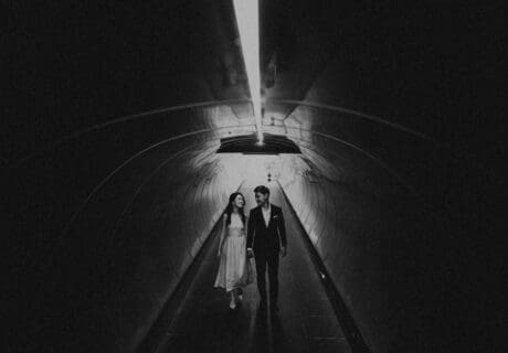 bride and groom in tunnel