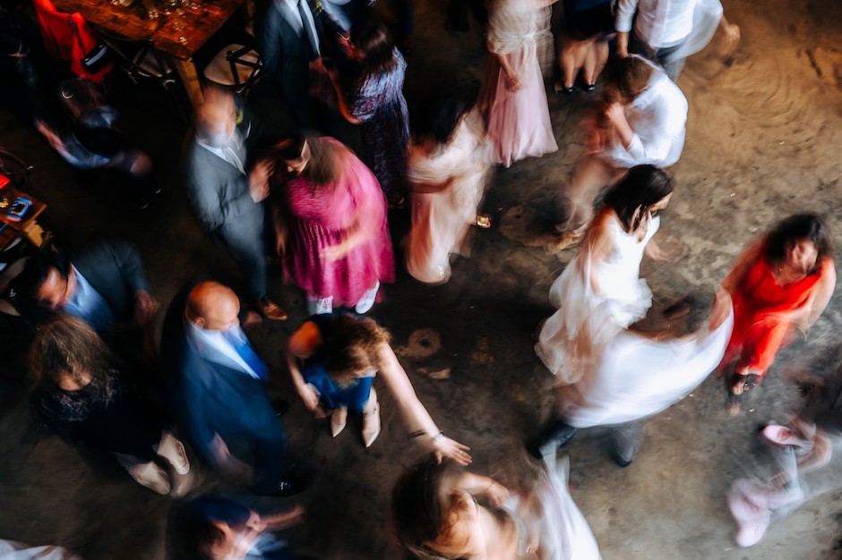 guests and bride dancing during reception.