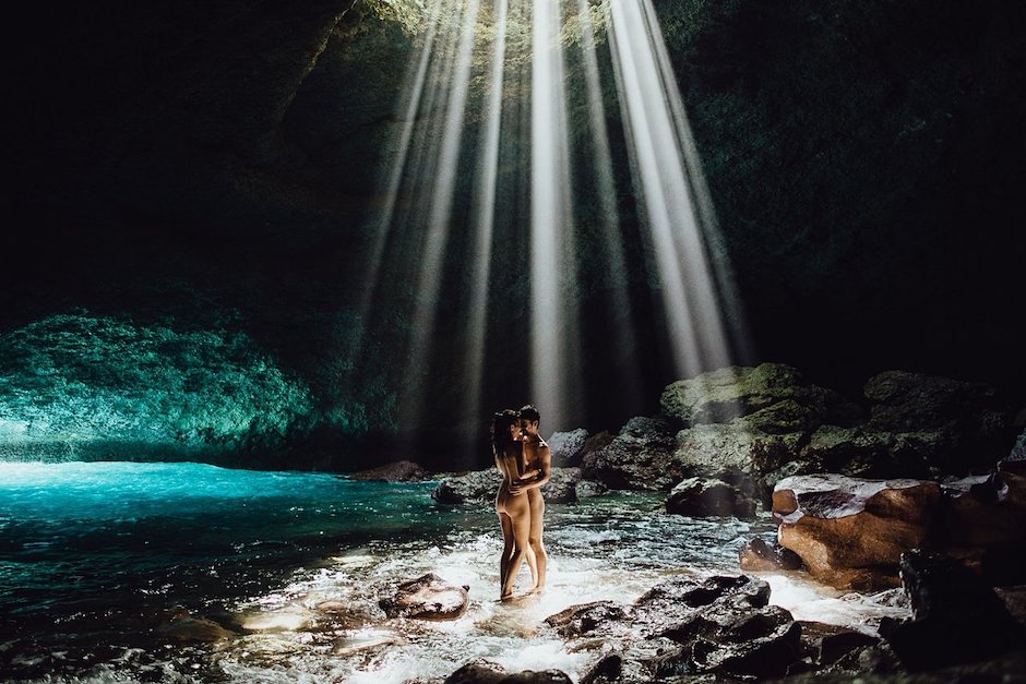 naked couple in cave for daring photo composition.
