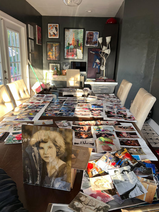 photos on dining room table, damaged during hurricane Ian.