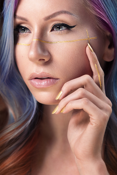 portrait with temporary tattoo on face.