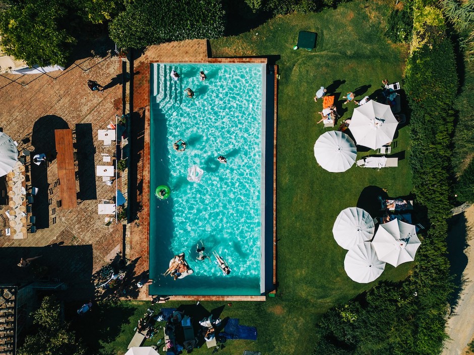 wedding day moments include this drone shot of a pool party in Italy.