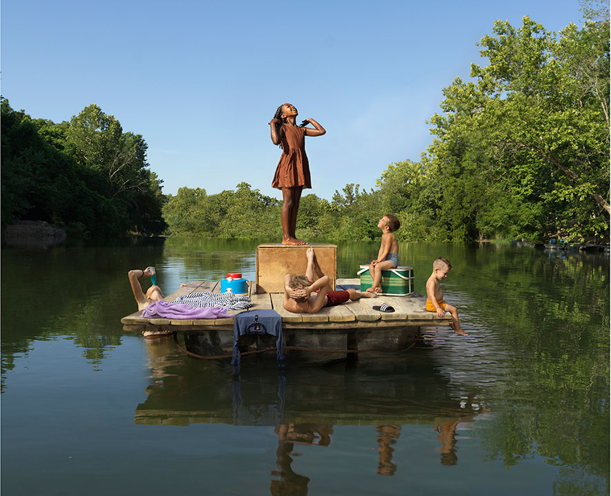 Flatboat by Julike Blackmon, of kids on wooden platform on lake,